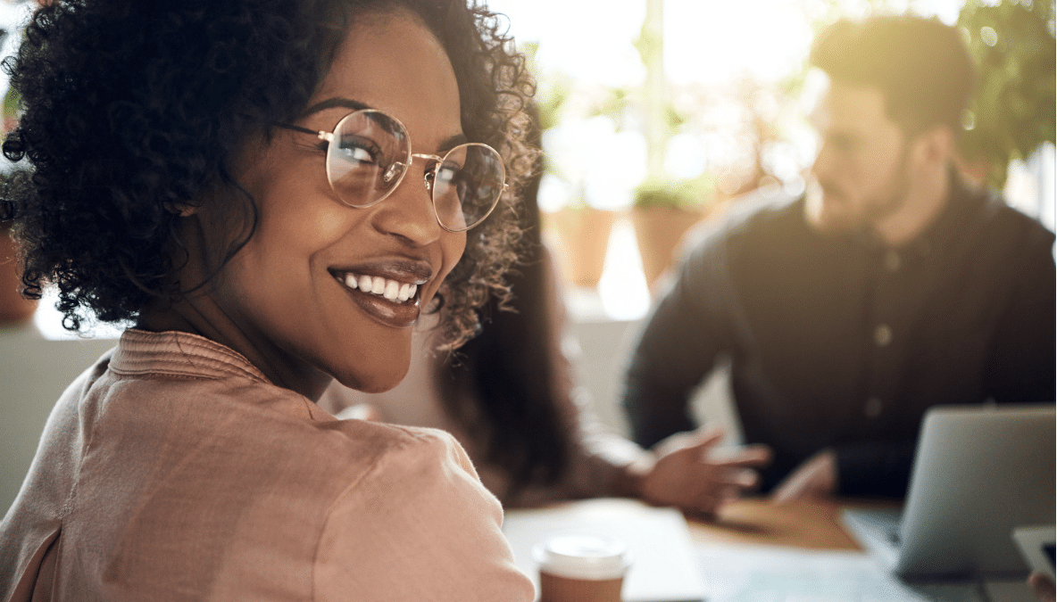 portrait of black female employee among coworkers